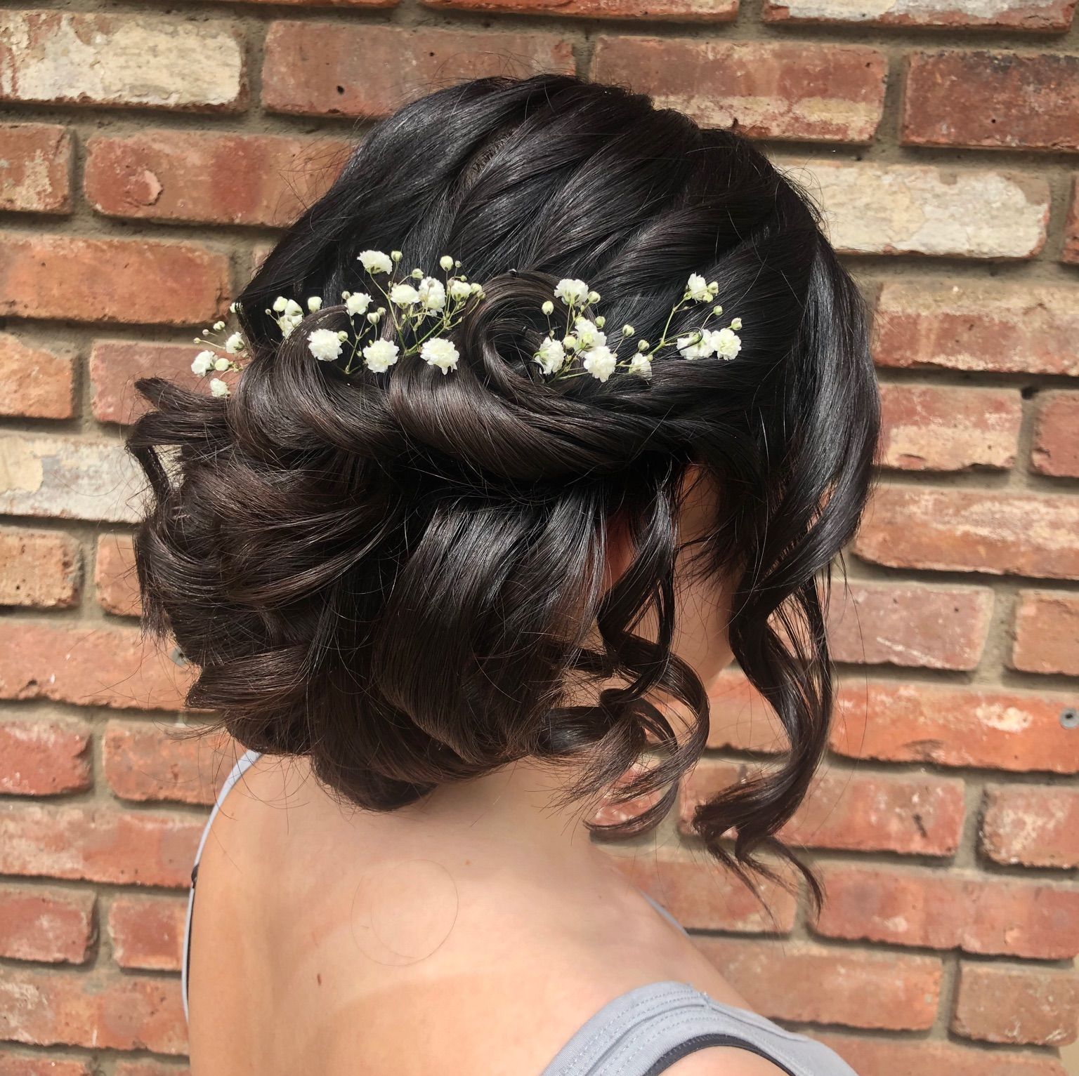 updo with baby's breath and curls