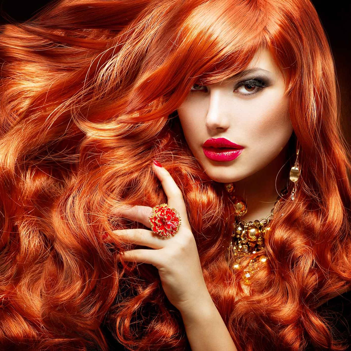 lady with beautiful red hair and funky ring